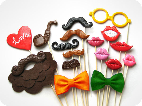 fun-wedding-details-for-the-reception-mustache-theme-wedding-finds-colorful-photo-booth-props